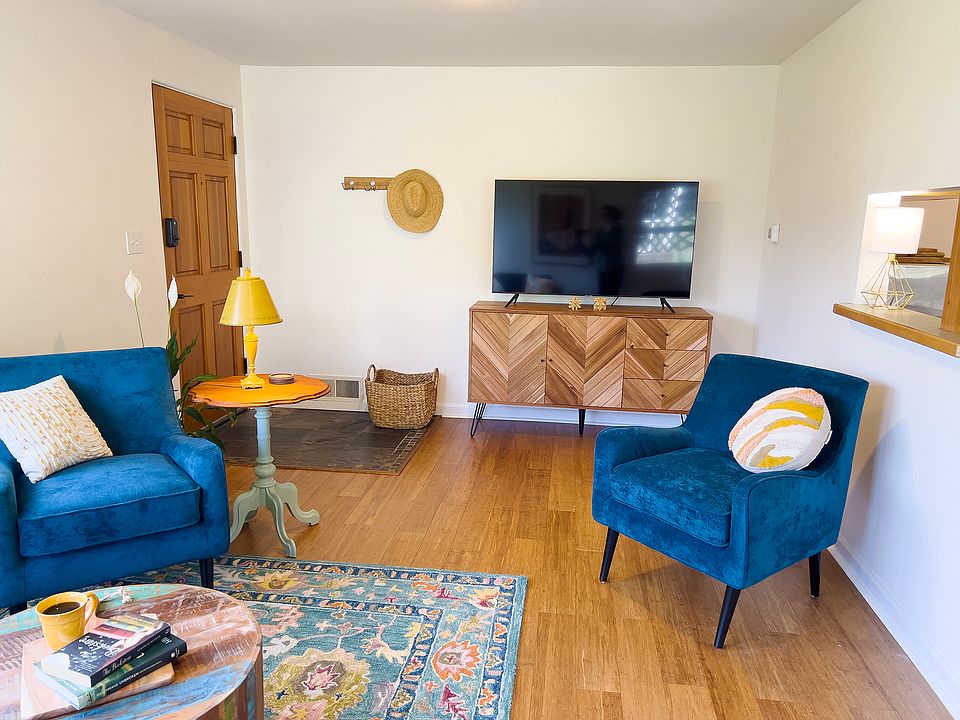 Living room seating and Smart TV.
