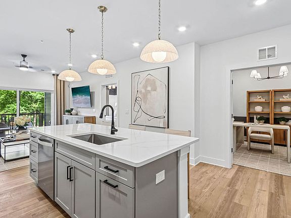 Gourmet Kitchen Overlooks Den and Gathering Room
