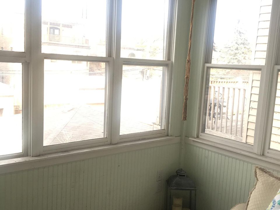 Unheated, enclosed, secure back porch.