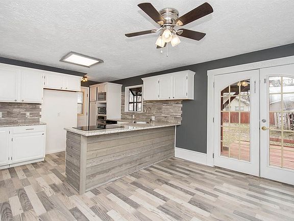 Remodeled kitchen.  Check this out!  Doors go to covered deck (balcony off master upstairs).