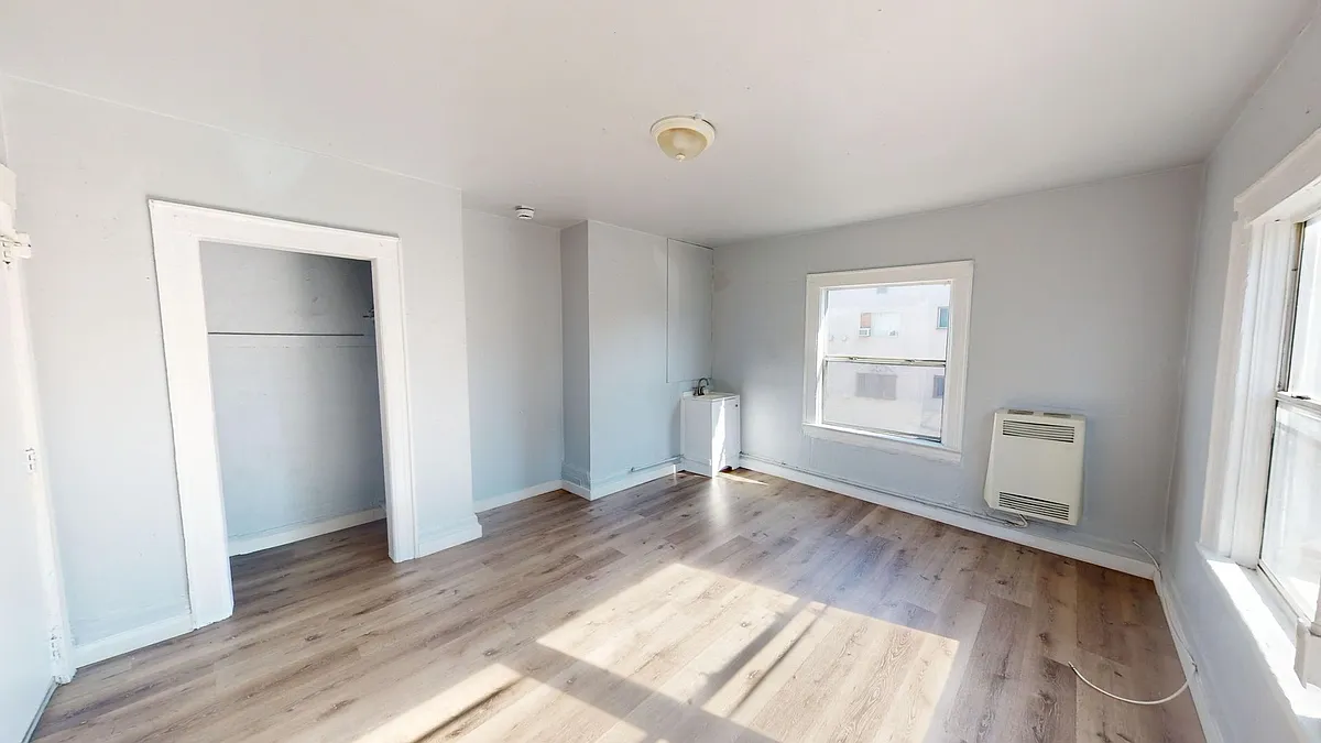 Building Photo - **COMMUNAL (SHARED) HOUSING AVAILABLE** Dormitory Style
