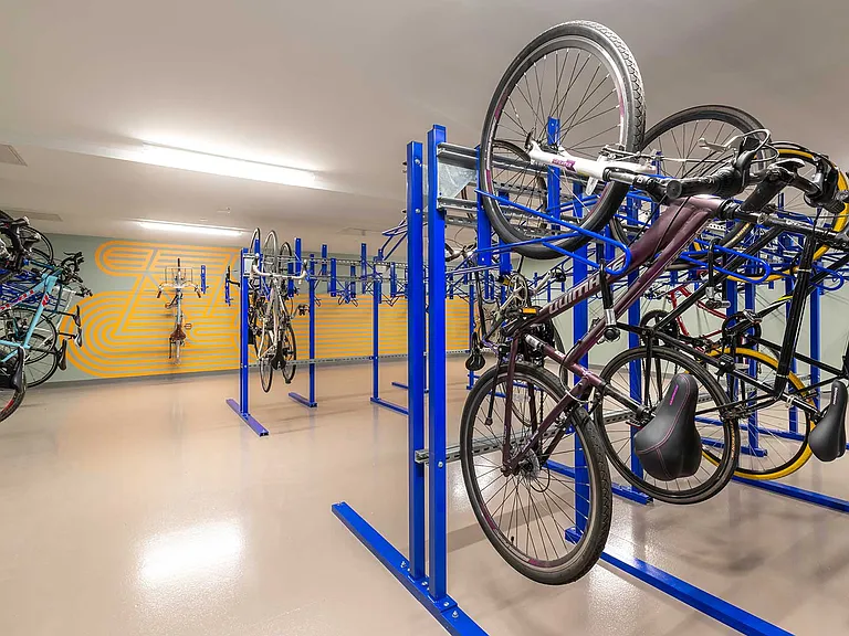 Secure your ride with ease. Eleven33's bike storage room features vertical racks, ample space, and bright design built for urban cyclists on the go.