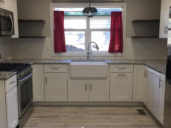 New cabinets, granite and farm sink.