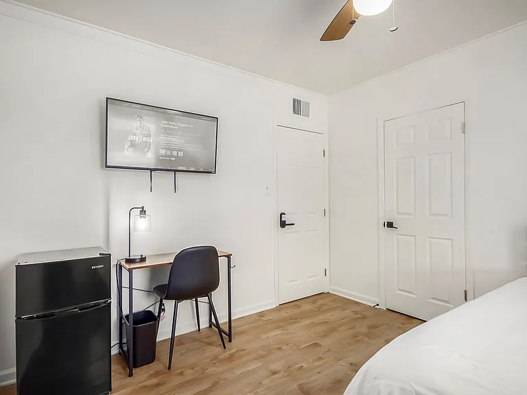 Desk with lamp and full closet