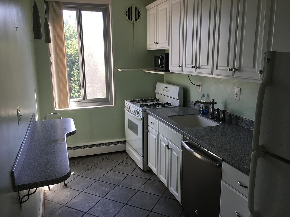 Kitchen with tree-top views