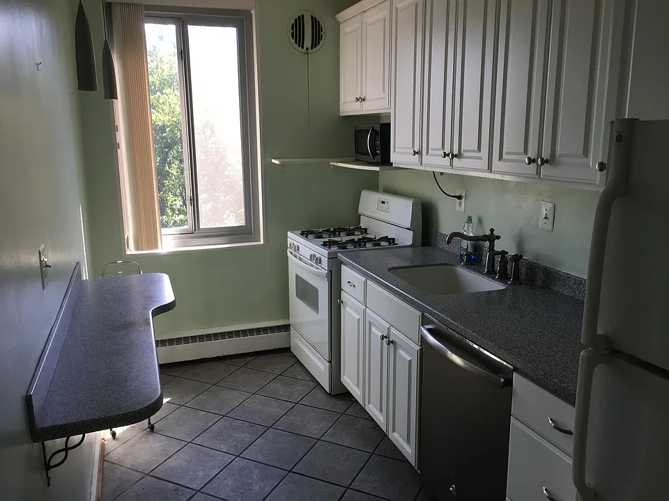 Kitchen with tree-top views