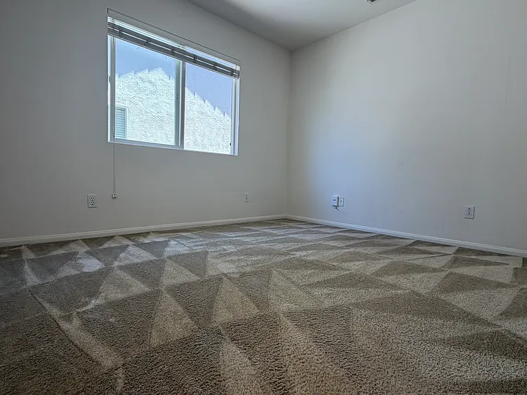 Guest bedroom one with window