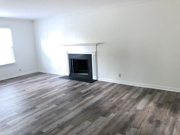 Living / Dining Room with Fireplace (I will have flu cleaned) -- New blinds throughout house -- new flooring