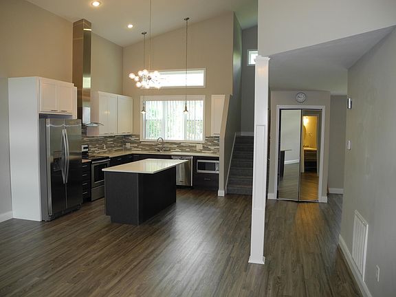 Efficient kitchen features island with casual bar seating