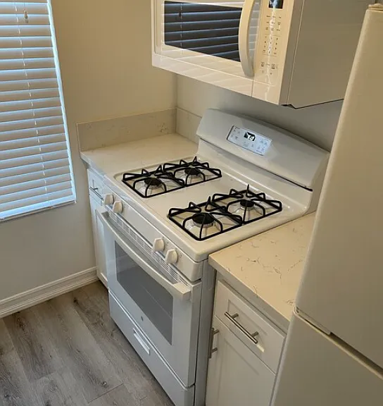 Gas stove and overhead microwave included