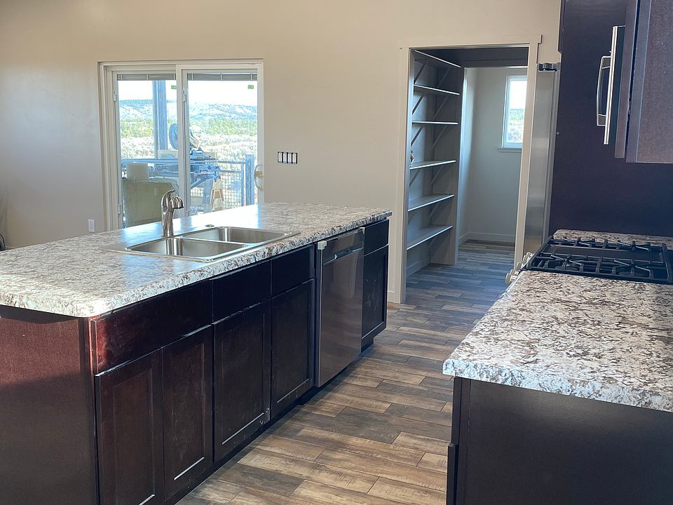 Kitchen and living room sliding door to balcony.