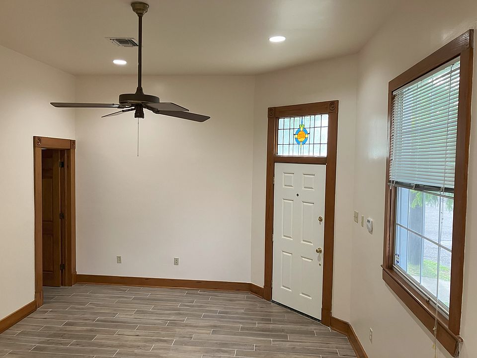Recessed lighting in living room, dining room, kitchen and bath, ceiling fans in liv rm and both bedrooms