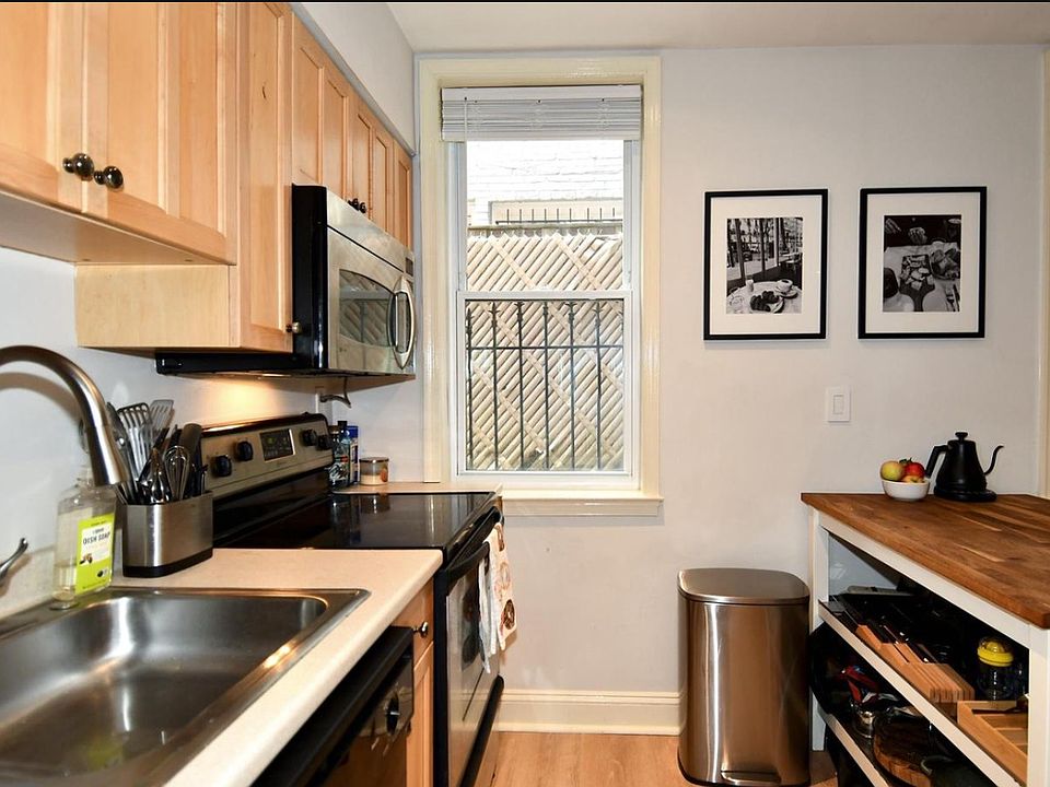 Contemporary Fully-equipped Galley Kitchen with natural light