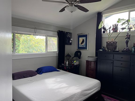 Master bedroom 150+ inches along wall with bed.