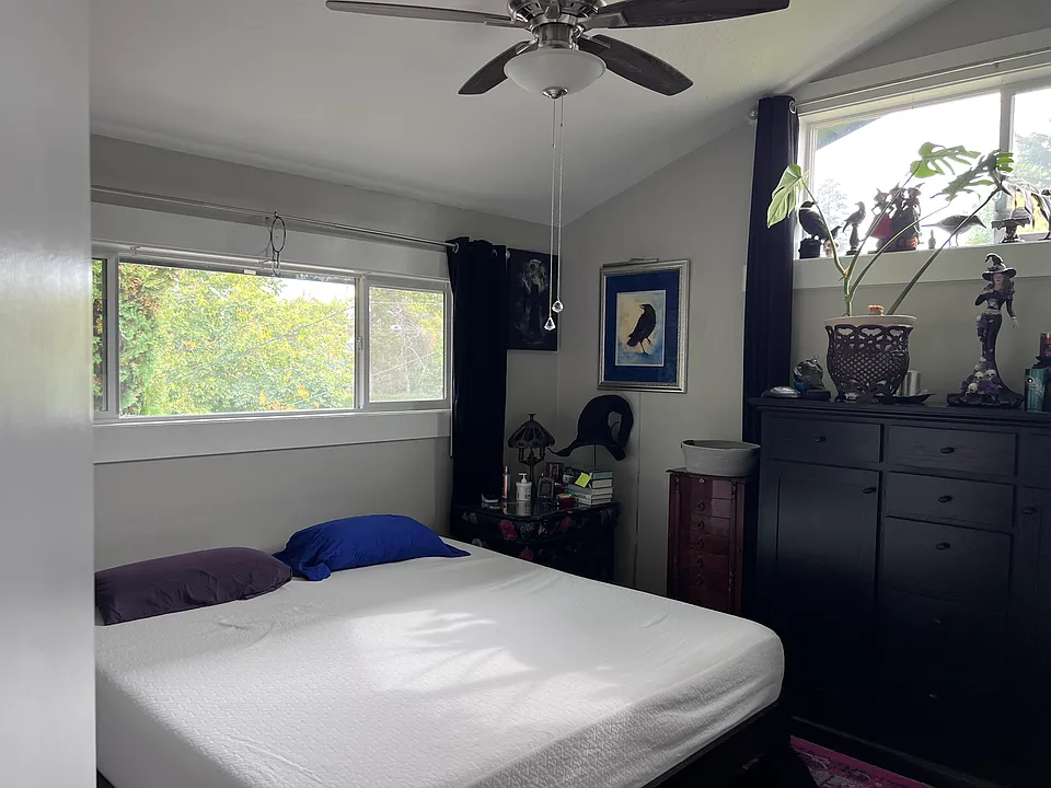 Master bedroom 150+ inches along wall with bed.