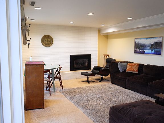 Living Room with Gas Fireplace and dimmable lighting.