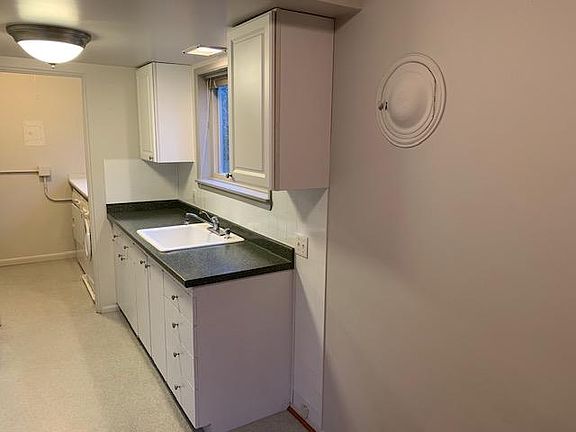 Kitchen looking into laundry room
