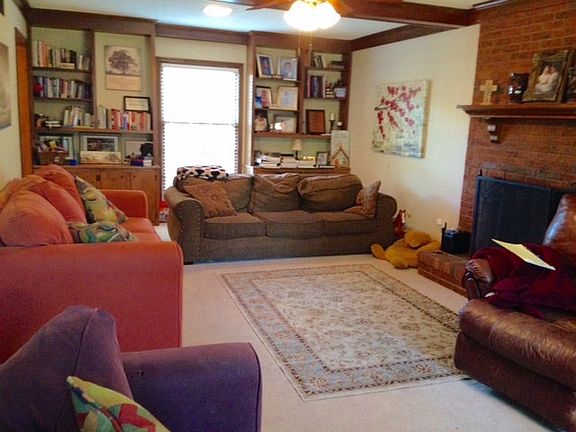 Family room with wood burning fireplace