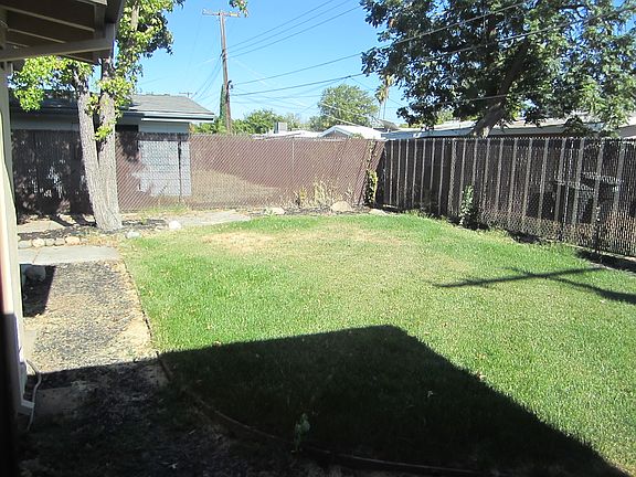 back lawn has sprinklers