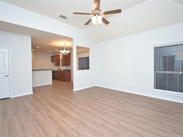 Living facing Dining and Kitchen