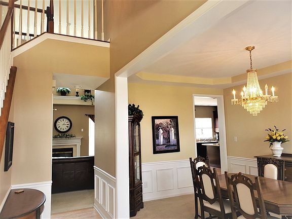 Foyer through Dining to Family Room and Kitchen.