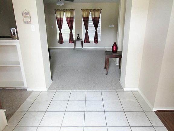 Tiled entrance leads to family room straight ahead or dining room to the right.