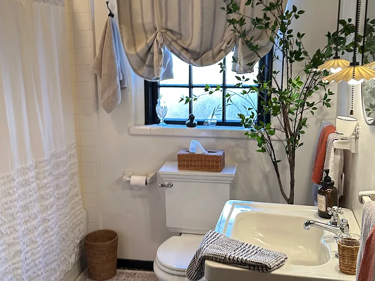 Vintage bathroom with original fixtures for one of a kind character, full size shower and tub