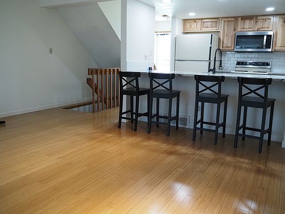 Main level entry way and stairs. Hardwood floors. Bar chairs. Newly remodeled kitchen and granite countertops. New microwave, sink, disposal, and dishwasher. Dimmer switch lighting. USB outlets.