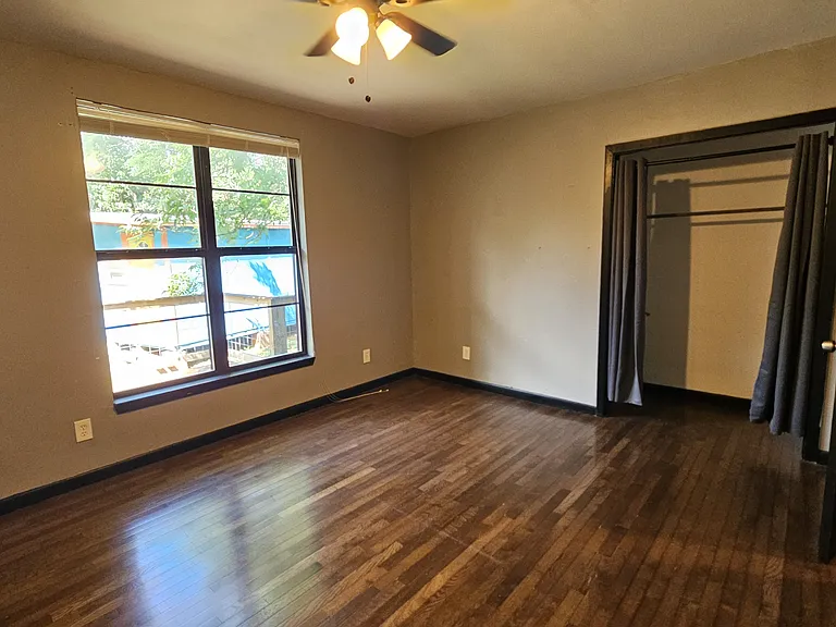 Second bedroom with backyard_facing windows, conveniently located across from the hallway bathroom