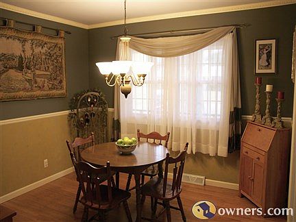 Formal Dining with Hardwood and Crown Moulding