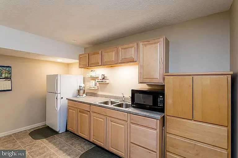 Basement Kitchen, not pictured - new fridge, dishwasher, oven, stove and new oven range.
