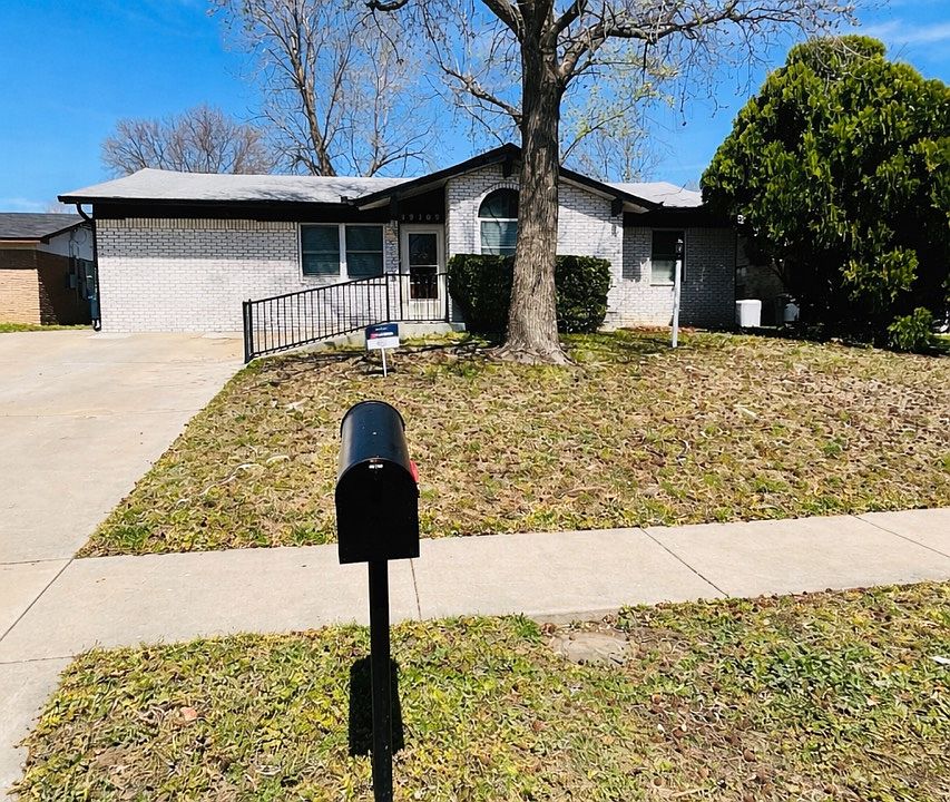 Street view (parking in driveway). 2-car garage and office/storage located in rear of house.