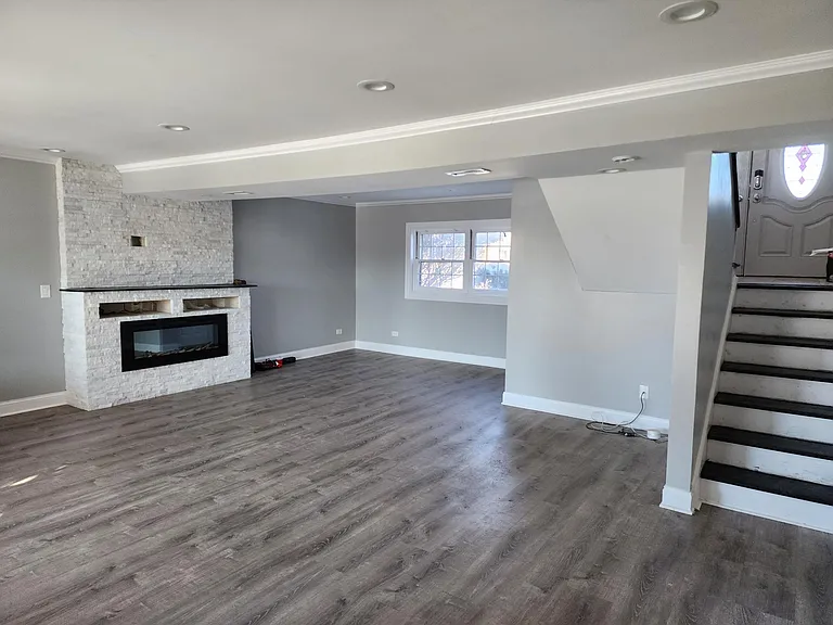 First Floor: Super spacious living room, with electric fireplace, little corner nook for a computer desk, plenty of room!