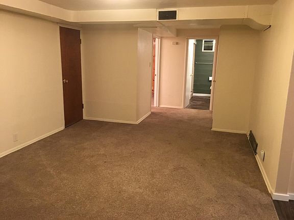 Unit B looking from living room towards bathroom and bedroom and office