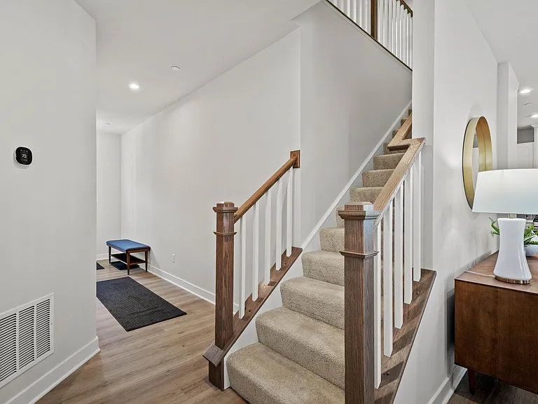 Neutral luxury vinyl plank flooring throughout the main level