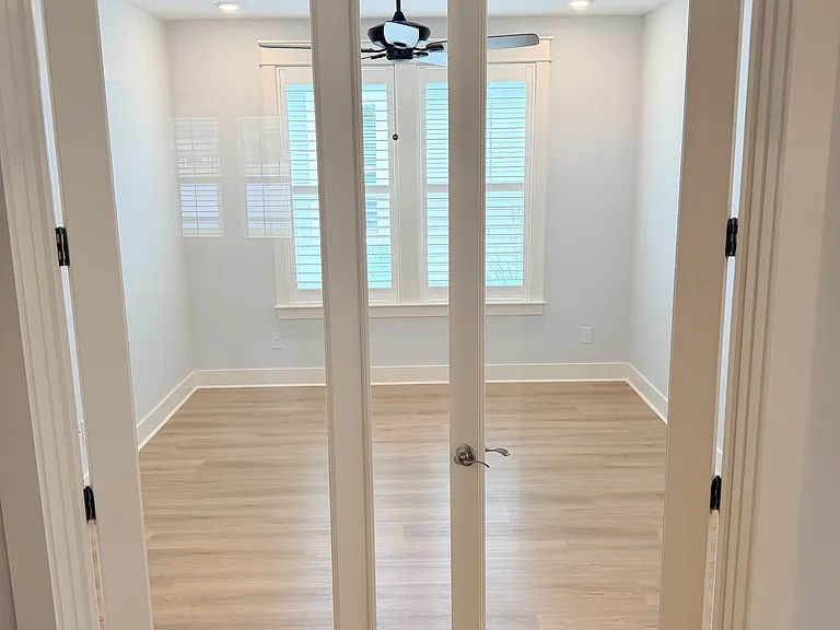 Den with French doors offering flexible extra living space