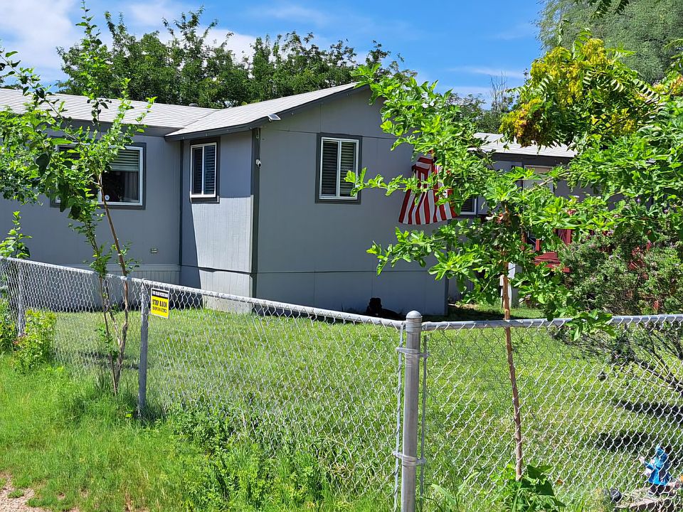 left side driveway (there are 2). fully fenced yard.
