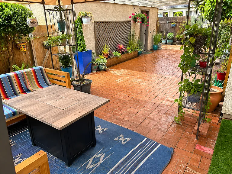 patio in yard (yard furniture and canopy not included)