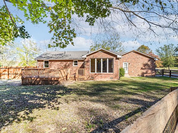 The backyard offers a large deck perfect for enjoying the views and serenity of the property.