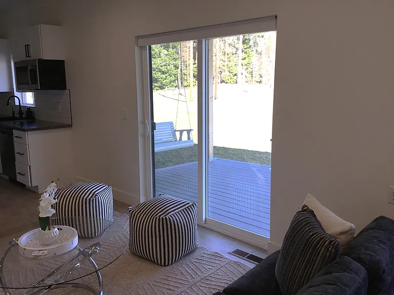 Warm and welcoming home designed for gathering and everyday comfort, where the kitchen, dining, and sitting areas flow beautifully together while overlooking peaceful mountain views and opening to the covered porch.