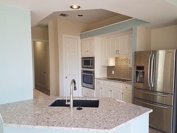 Updated kitchen with quartz countertops, Bosch appliances an