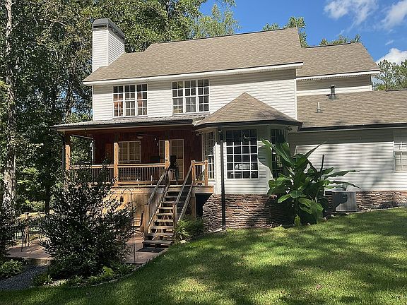 Shrubs flowers sodded yard