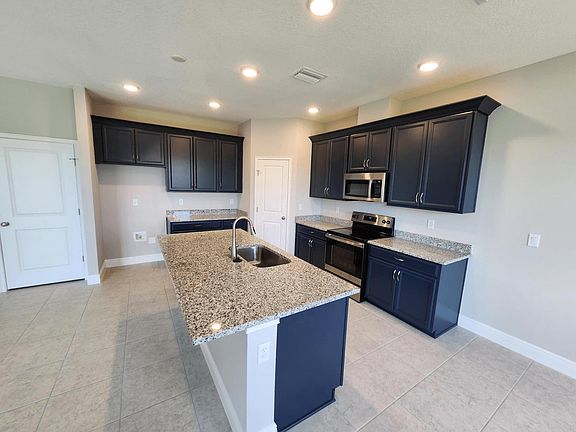 Sebring new construction home plan kitchen at BridgeWater by William Ryan Homes Tampa