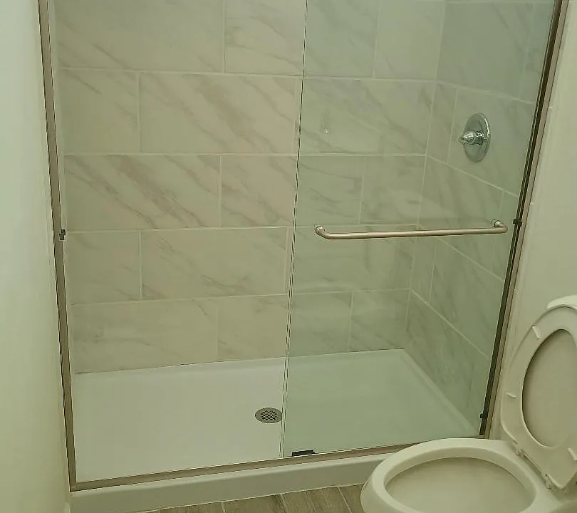 bathroom with granite countertop and ceramic flooring