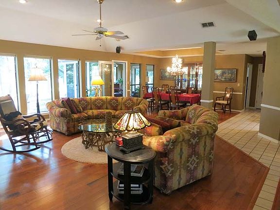 LR &amp; dining room with wall of windows to the golf course.