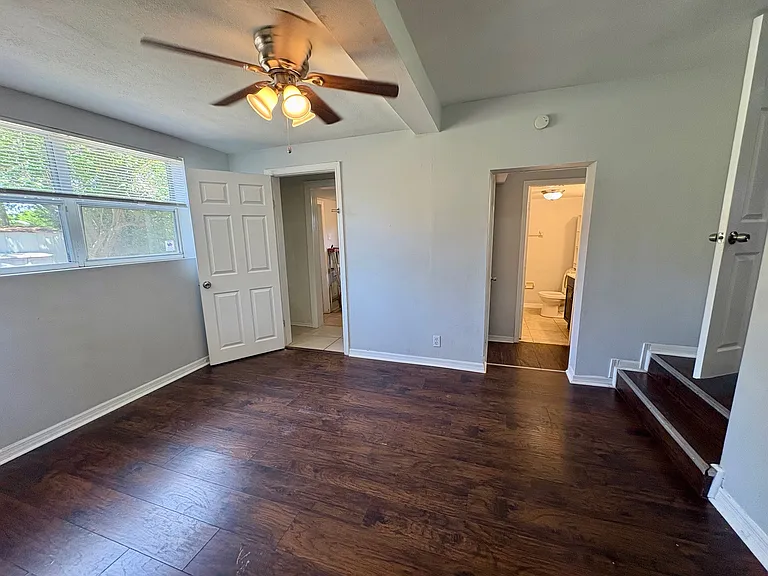 master living room with entries to the master bed/bath and the laundry room