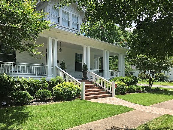 manicured lawn and shrubs