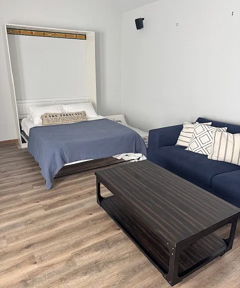 Bedroom #3 - Queen bed with single mattress on the floor and couch.