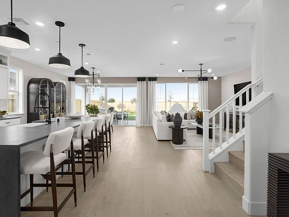 Kitchen with large central island open to main gathering space