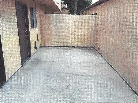 Patio (Doors to Kitchen and Garage and Sliding Doors to Downstairs Bedroom)